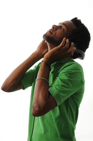 Africano chico disfrutando de la música con auriculares —  Fotos de Stock