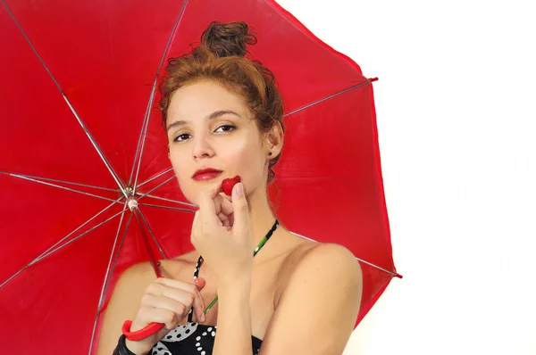 Girl with umbrella and strawberry — Stock Photo, Image