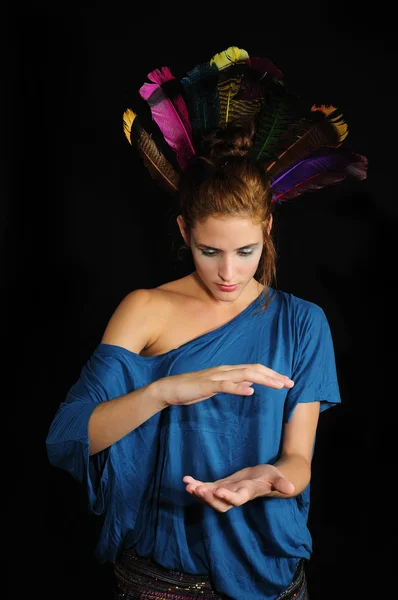 Young woman with feathers — Stock Photo, Image