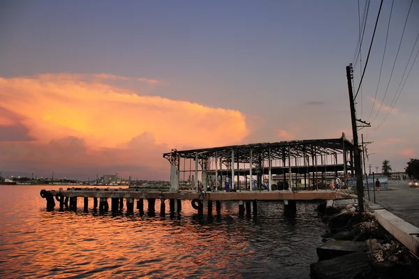 Abandoned pier at sunset — Stock Photo, Image