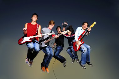 Musicians with guitars jumping in the air clipart