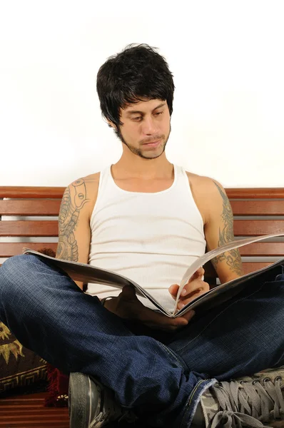 Young latino man reading — Stock Photo, Image
