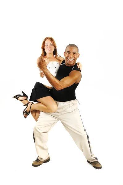 Latina instrutor de dança carregando menina — Fotografia de Stock
