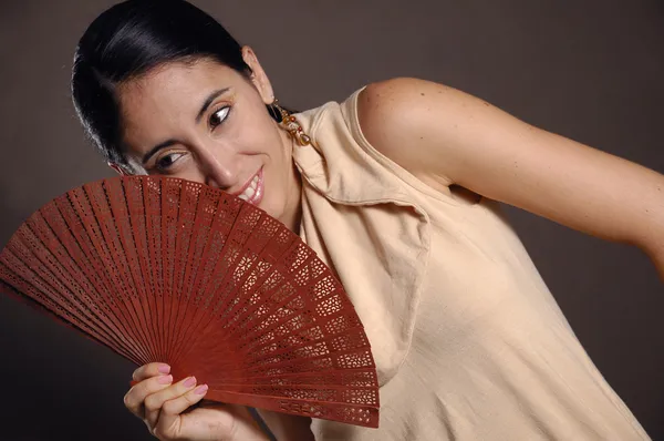 Hispanic woman with fan — Stock Photo, Image