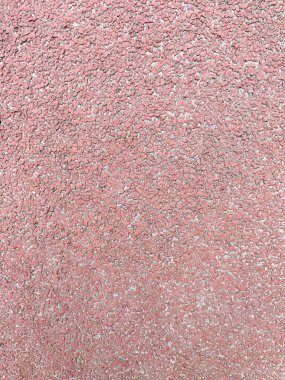 Dokulu kırmızı arka plan, stadyumlar için lastik kaplama, koşu pistleri, tenis kortları. Üst manzara, yakın çekim.