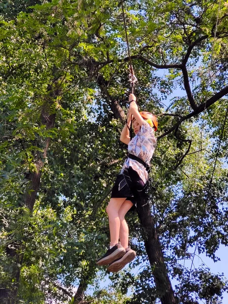 Teenager Descends Rope Cable Car Rope Amusement Park Backdrop Trees — Stock Photo, Image