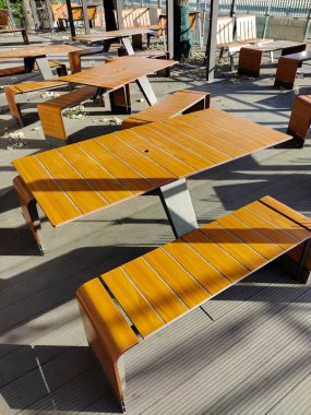 Empty chairs and tables in a fast food cafe closed for quarantine due to the COVID-19 pandemic. There are no people