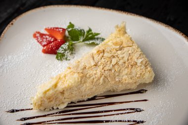 piece of cake with strawberries and mint