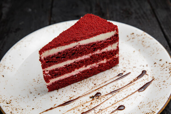 chocolate cake with red and black sauce