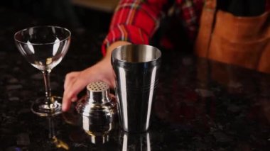 the barman prepares drinks in the restaurant