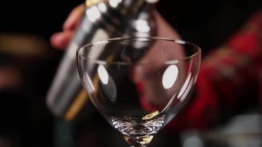 the barman prepares drinks in the restaurant