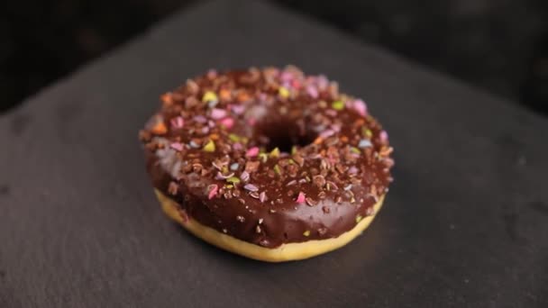 Beautiful Doughnuts Covered Chocolate Glaze Sprinkles Marshmallows Chopped Nuts — Video Stock