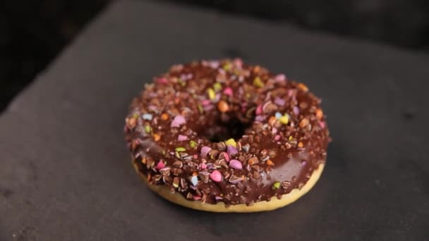 Beautiful Doughnuts Covered Chocolate Glaze Sprinkles Marshmallows Chopped Nuts — Stok Video