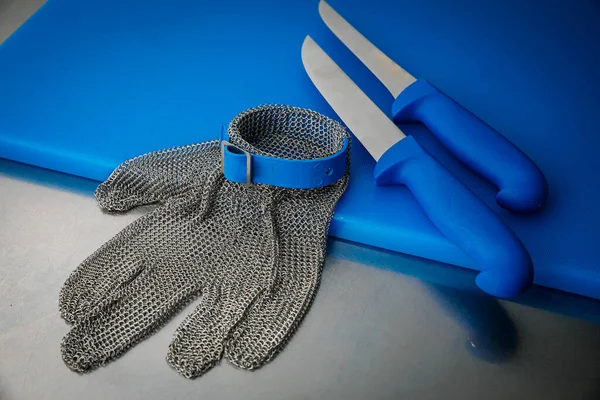 Professional kitchen. Knives, a board on the kitchen table