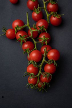 Cherry tomatoes on branches, top view