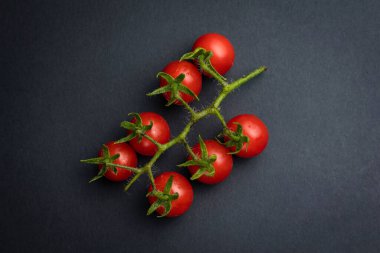 Cherry tomatoes on branches, top view
