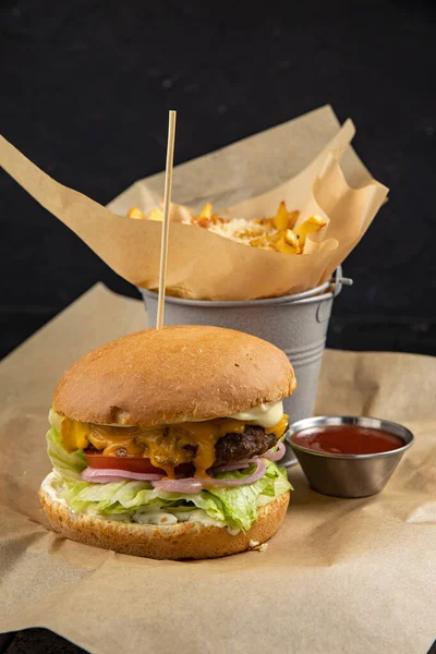 delicious burger with chicken, cheese and lettuce, close-up