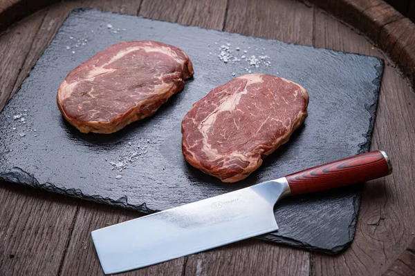 Raw marble meat, black angus ribeye steak.