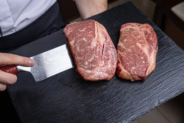 Raw marble meat, black angus ribeye steak.