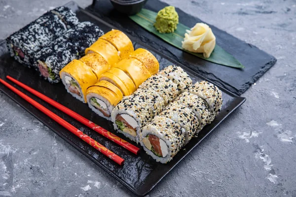 Delicious sushi, a set of rolls with tuna, salmon. Japanese cuisine