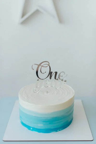 white-blue cake for the celebration of one year of the child