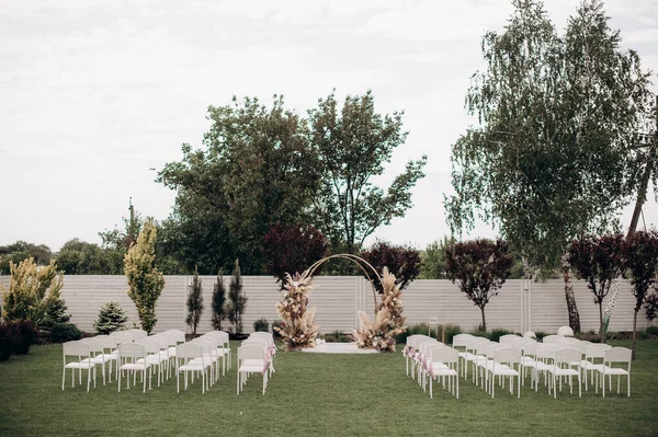 wedding ceremony on the lawn near the ranch