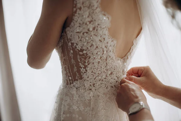 Female Hands Fasten Button Wedding Dress — стоковое фото