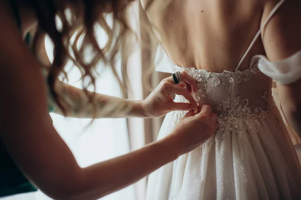 Female Hands Fasten Button Wedding Dress — стоковое фото