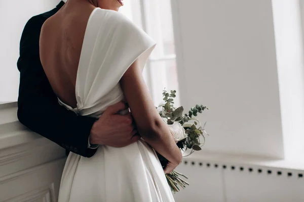 Groom Hugging Bride Waist — Stock Photo, Image