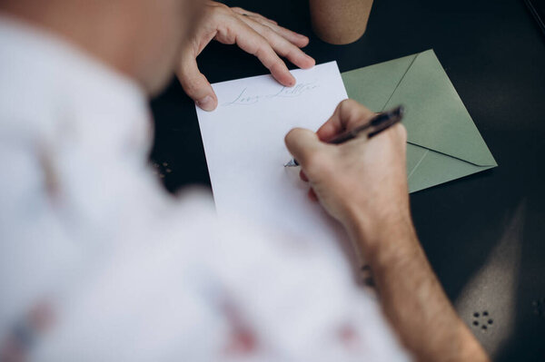 person writing on paper
