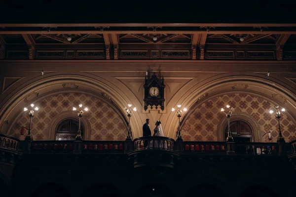 silhouettes of the newlyweds in the church