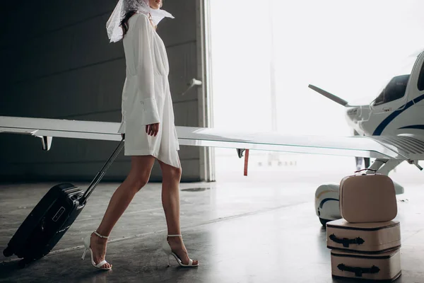 woman with suitcase and luggage at airport