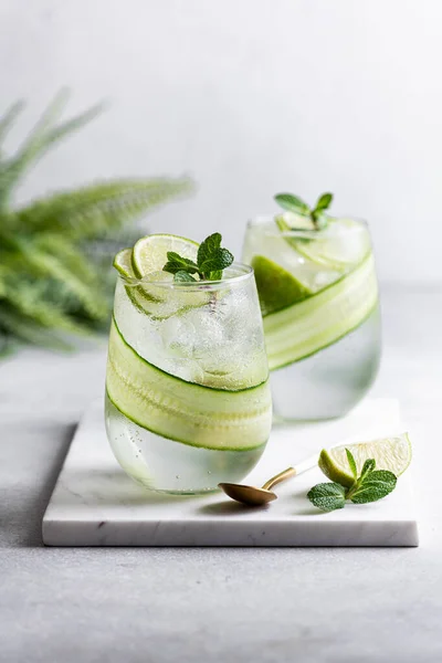 Summer refreshing cocktail with lime and cucumber, selective focus Royalty Free Stock Photos