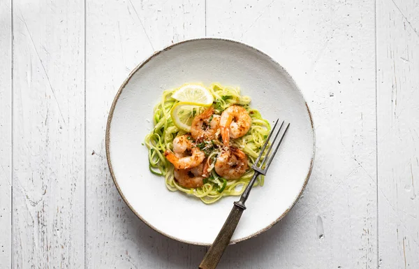 Spiralized zucchini noodles pasta with shrimps Stock Picture