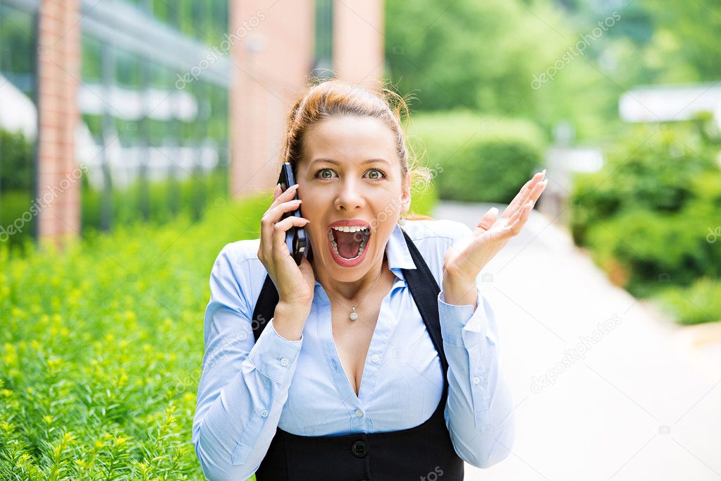 Surprised business woman on a phone