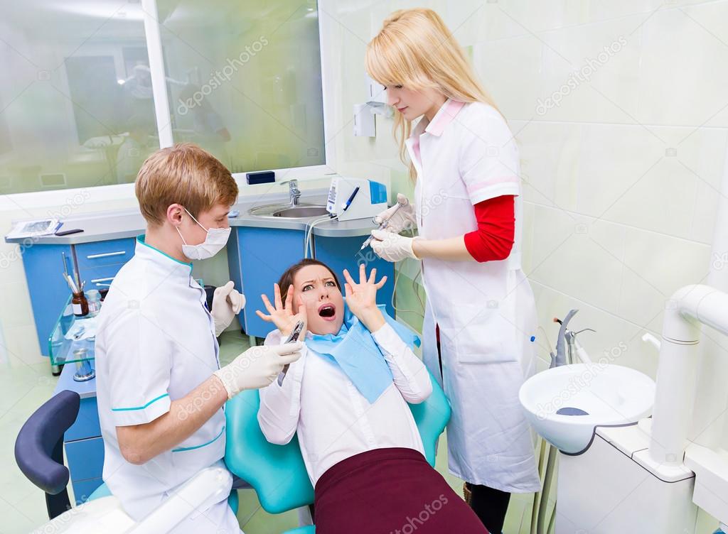 Female patient in dentist office scared, afraid of doctor, proce Stock  Photo by ©SIphotography 48219467