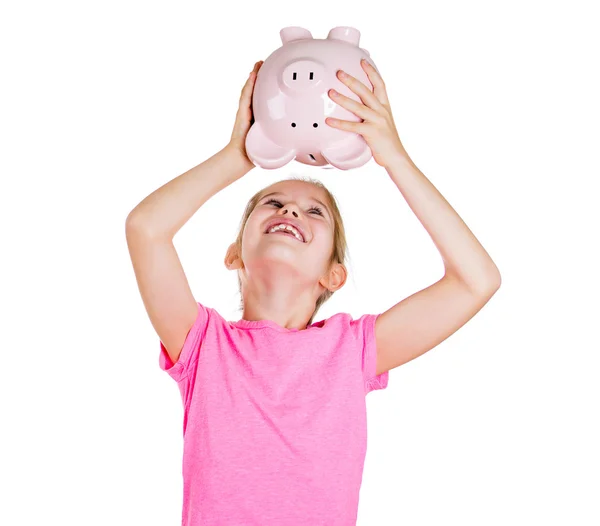 Klein meisje schudden haar piggy bank — Stockfoto