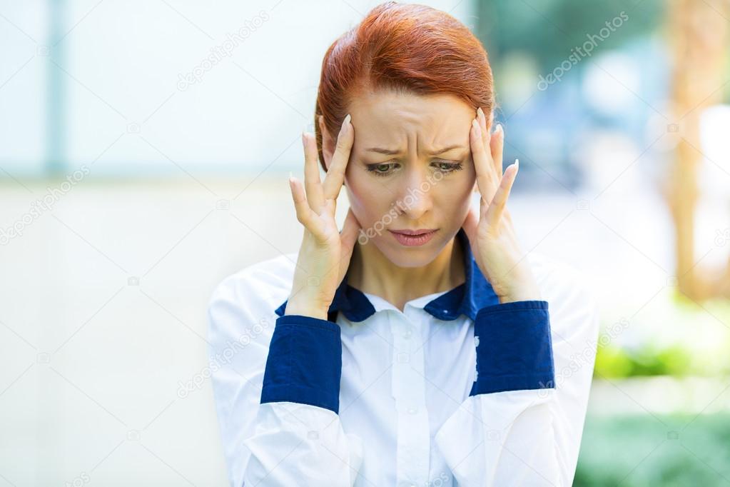 Stressed businesswoman with headache