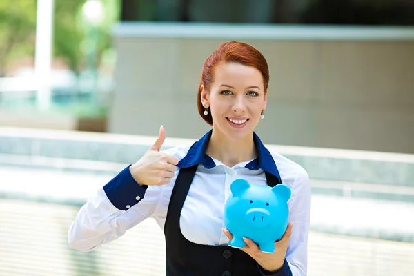 Happy woman, corporate employee holding piggy bank — Stock Photo, Image
