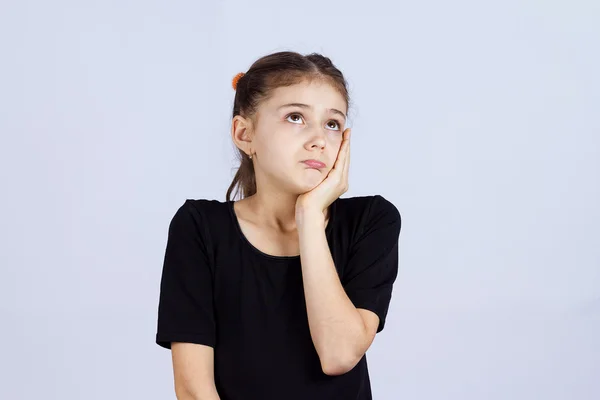 Sad daydreaming little girl Royalty Free Stock Photos