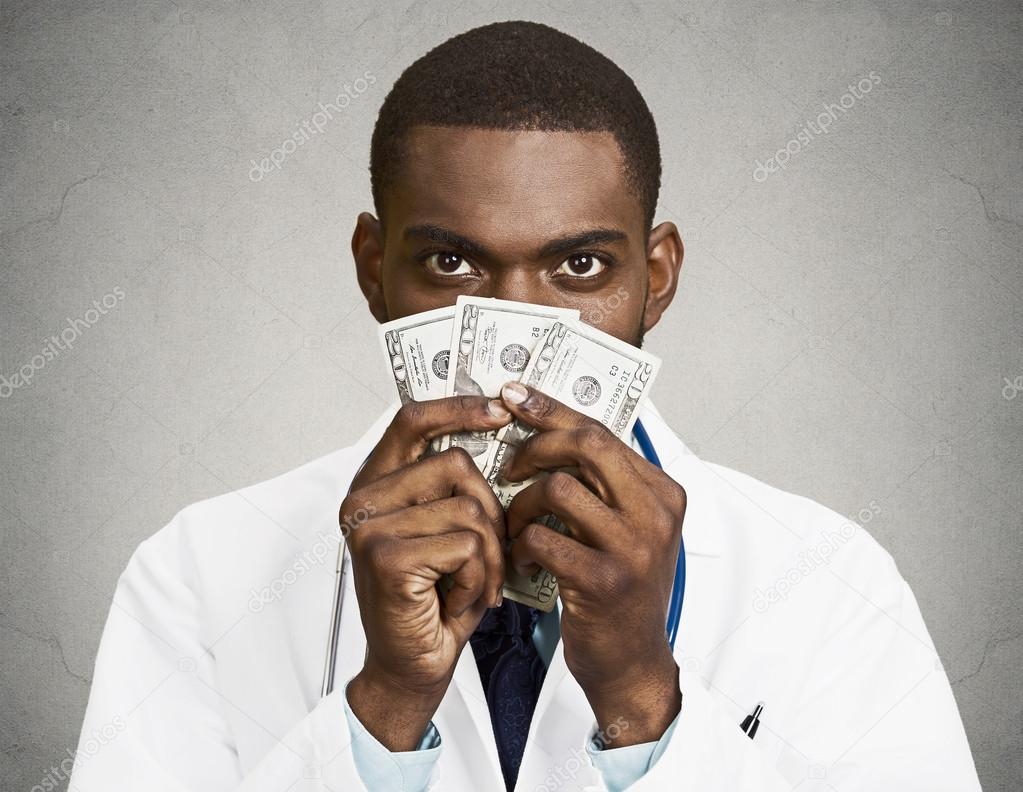 Greedy health care professional, doctor holding cash, money