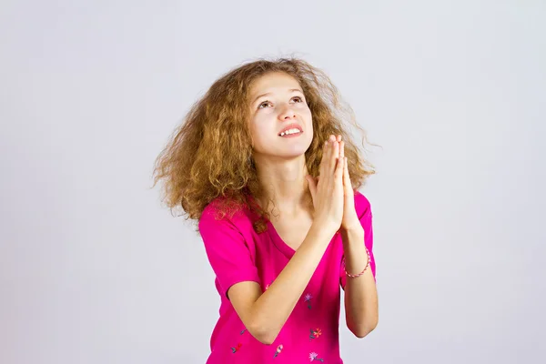 Young girl praying Royalty Free Stock Images