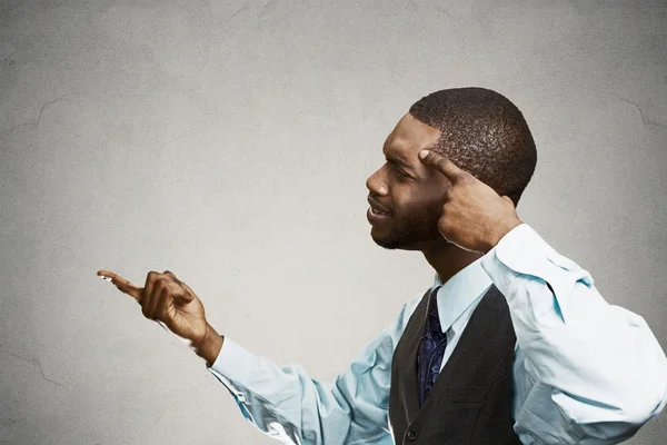 Upset angry man asking someone are you crazy, idiot? — Stock Photo, Image