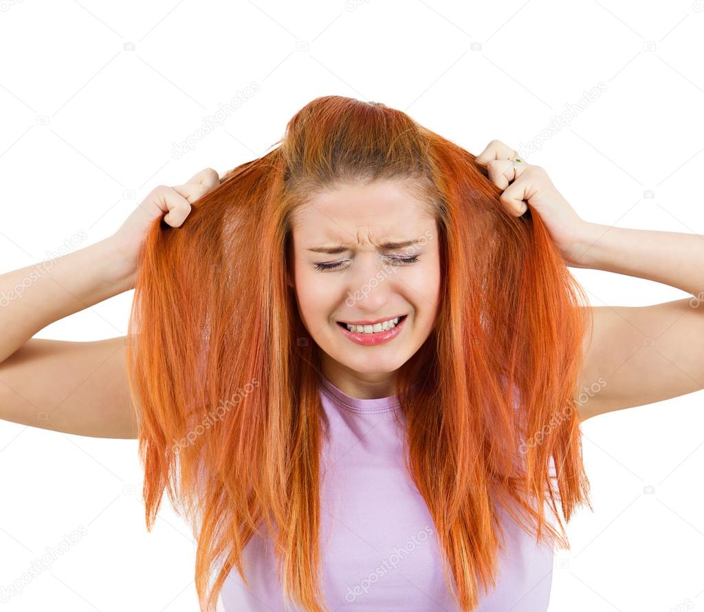 Stressed woman pullling her hair out