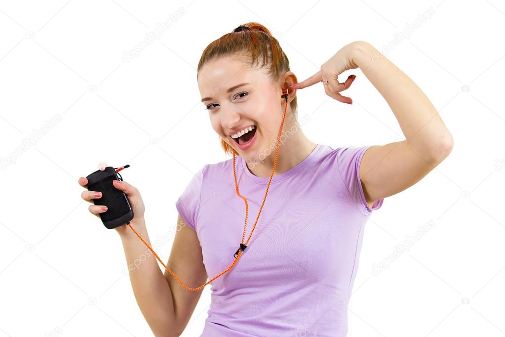 Happy young woman listening music on her mp3 player