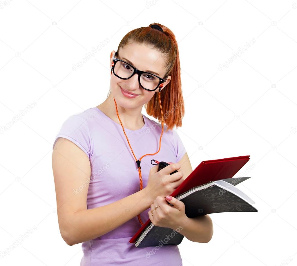 Happy student holding books, listening on music