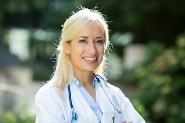 Portrait of a happy health care professional, female doctor clipart