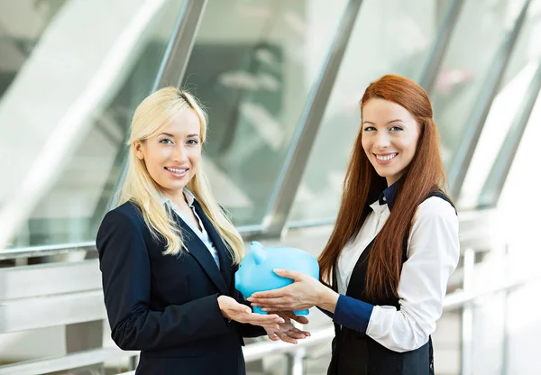 Corporate employee giving piggy bank to happy customer — Stock Photo, Image