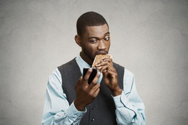 Executive holding smart phone, eating cookie clipart
