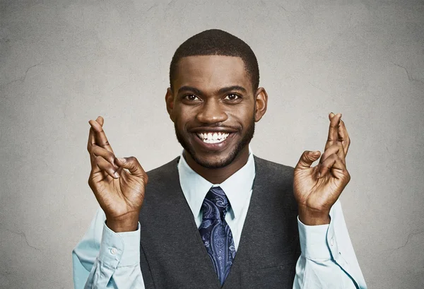 Hopeful businessman crossing his fingers — Stock Photo, Image